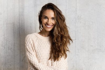 Smiling young woman feeling happy